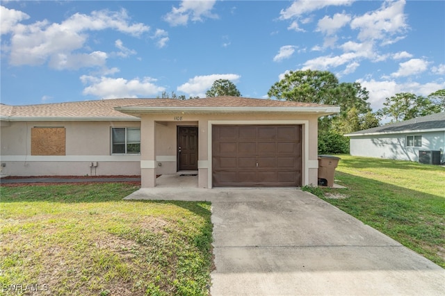 ranch-style home with central AC, a front lawn, and a garage