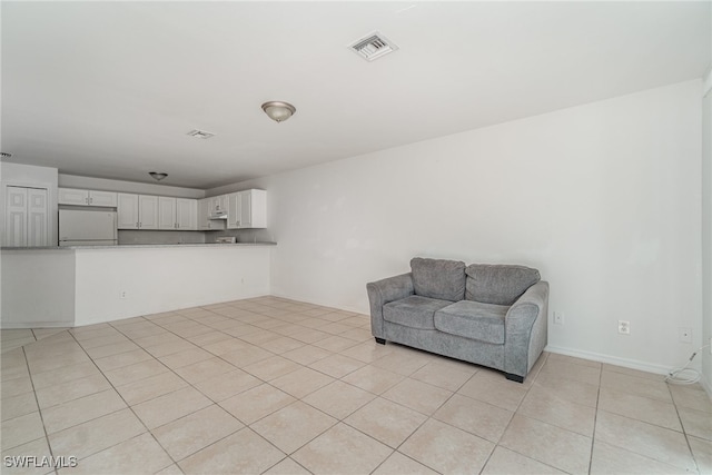 living area with light tile patterned floors