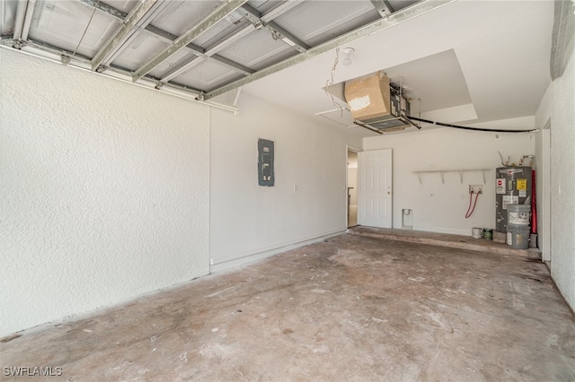 garage with electric water heater and electric panel