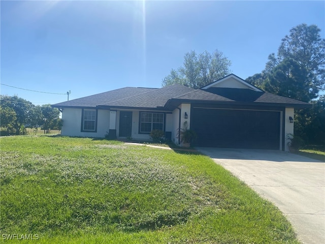 ranch-style house with a garage and a front lawn