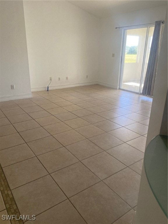 empty room with light tile patterned floors