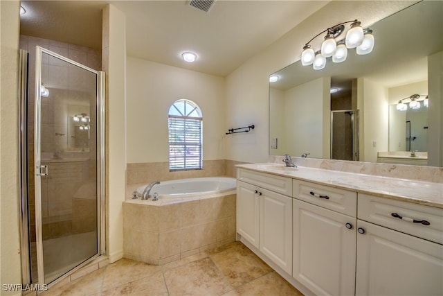 bathroom with vanity, tile patterned flooring, and plus walk in shower