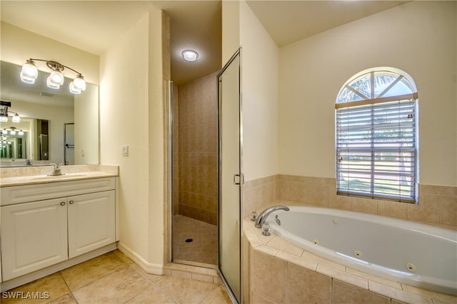 bathroom with plus walk in shower, vanity, and tile patterned floors