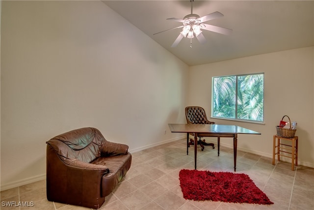 office featuring ceiling fan, light tile patterned floors, and vaulted ceiling