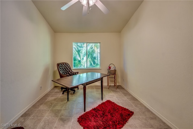 office area featuring light tile patterned floors, vaulted ceiling, and ceiling fan