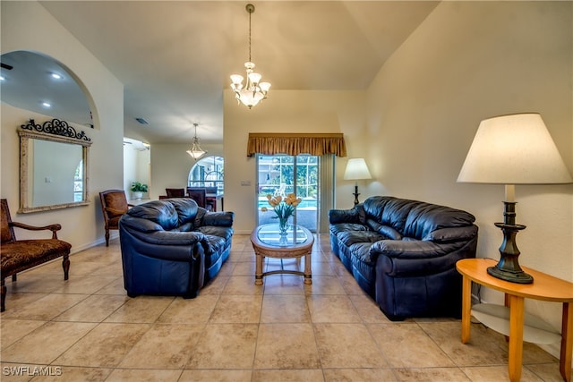 living room featuring light tile patterned floors, a chandelier, and lofted ceiling