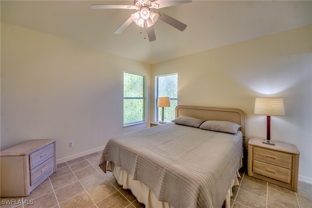 tiled bedroom with ceiling fan