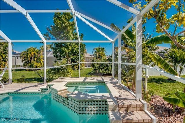 view of swimming pool featuring a lanai, an in ground hot tub, and a patio