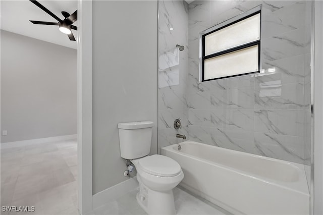 bathroom featuring tiled shower / bath combo, toilet, and ceiling fan