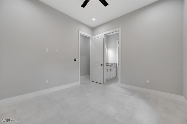 unfurnished bedroom with connected bathroom and ceiling fan