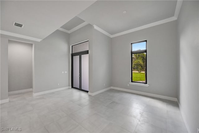 unfurnished room featuring crown molding