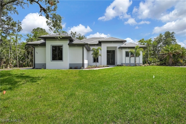 rear view of house with a yard