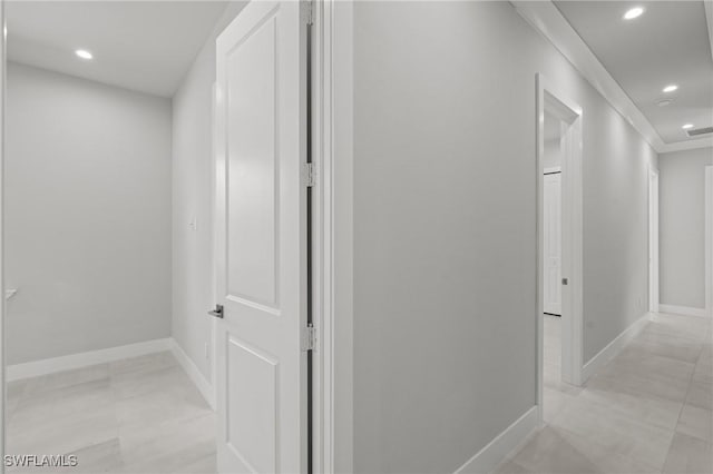 hallway with light tile patterned floors