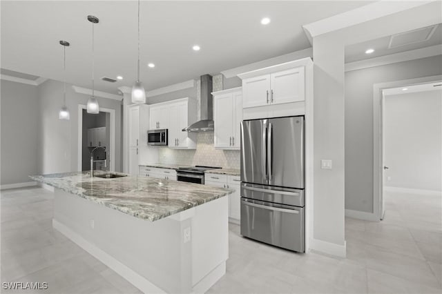 kitchen featuring stainless steel appliances, a large island, white cabinets, and wall chimney exhaust hood