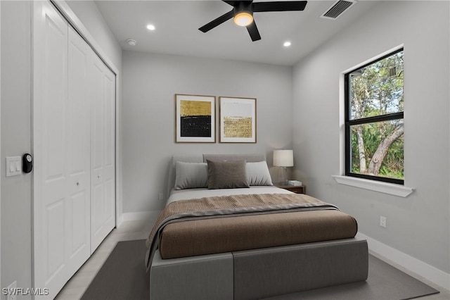 bedroom featuring ceiling fan and a closet