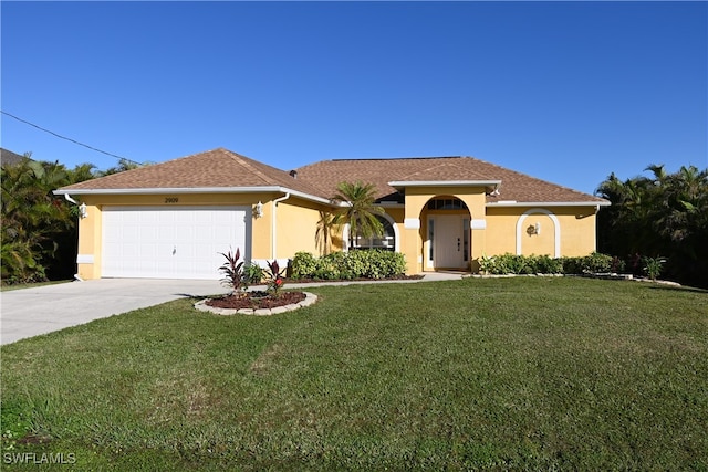 view of front facade with a garage and a front yard