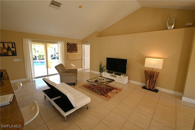 tiled living room with high vaulted ceiling