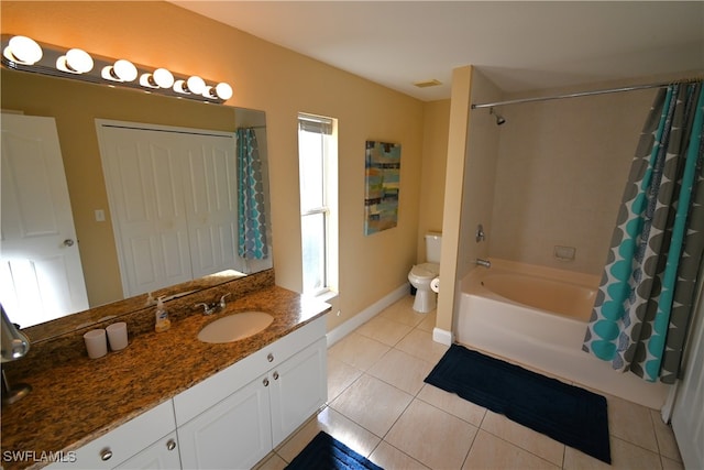 full bathroom featuring tile patterned flooring, toilet, shower / bathtub combination with curtain, and a healthy amount of sunlight