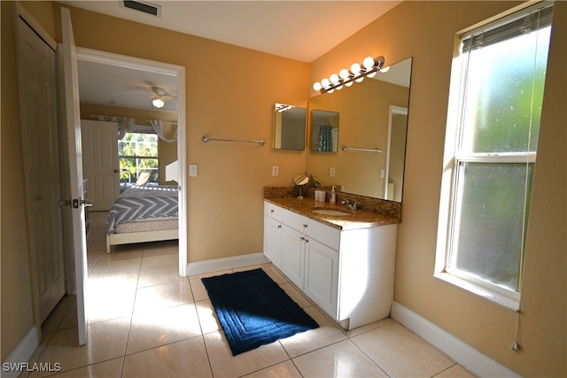 bathroom with tile patterned floors, ceiling fan, and vanity