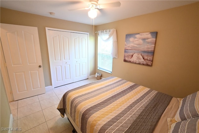 bedroom with a closet, ceiling fan, and light tile patterned flooring