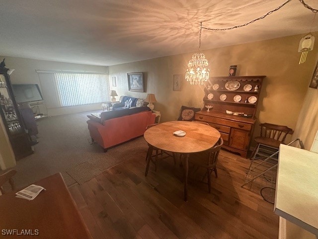 dining room featuring hardwood / wood-style flooring and a notable chandelier