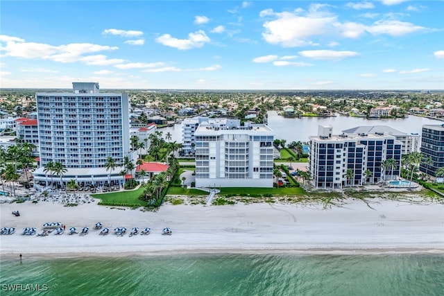 bird's eye view featuring a water view and a beach view