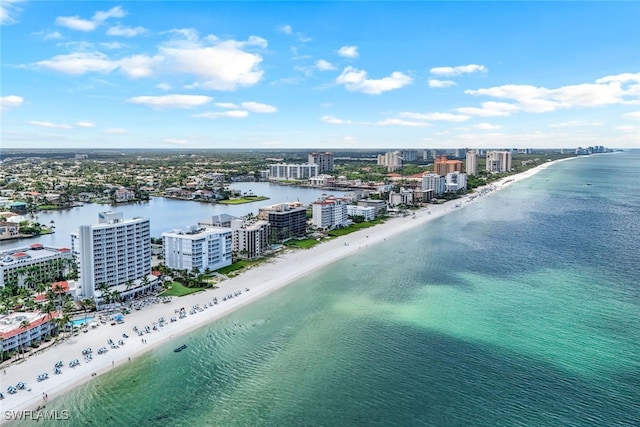 drone / aerial view featuring a view of the beach and a water view