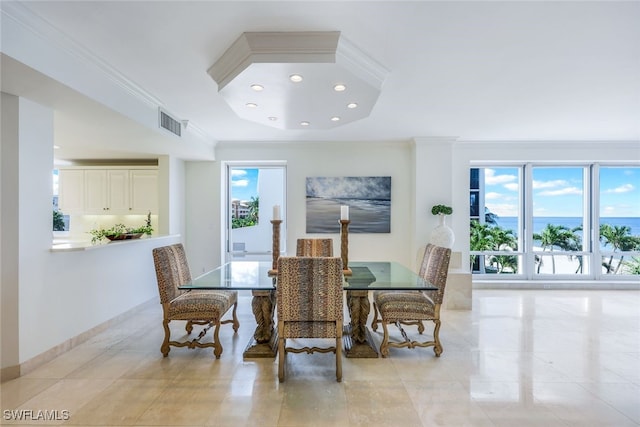 dining area with ornamental molding