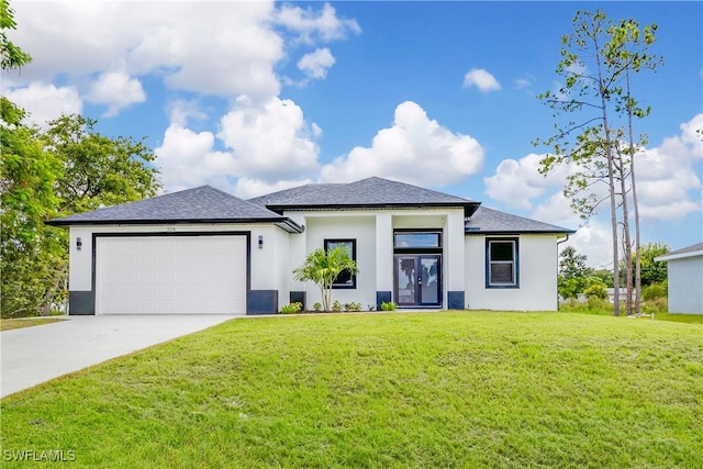 view of front of house with a garage and a front lawn