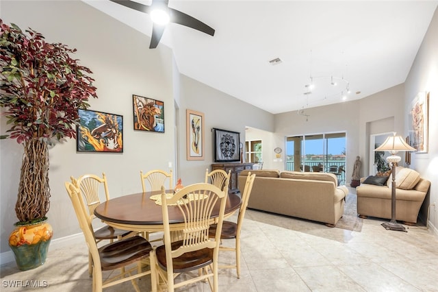 tiled dining room with ceiling fan