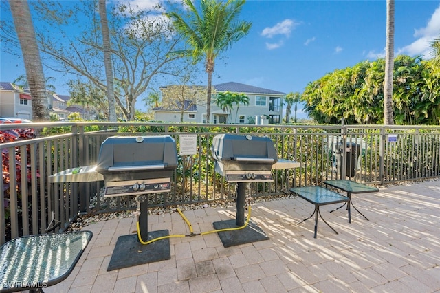 view of patio featuring a balcony