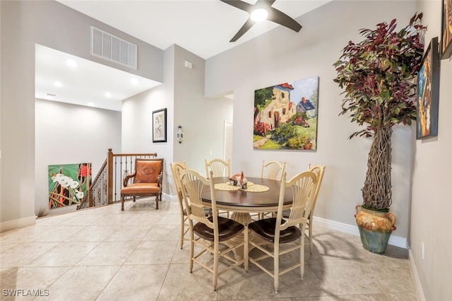 tiled dining space featuring ceiling fan