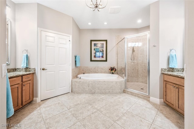 bathroom with vanity, independent shower and bath, and a notable chandelier