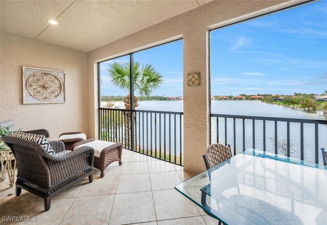 sunroom with a water view