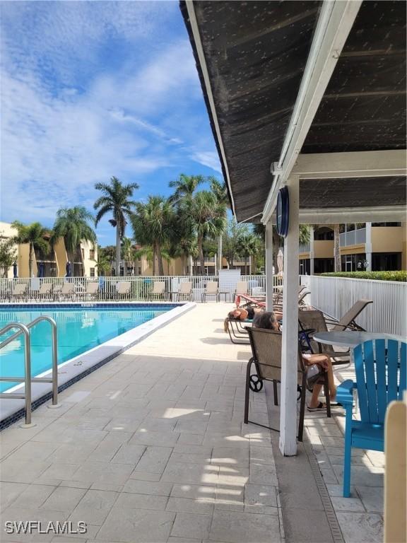 view of swimming pool featuring a patio area