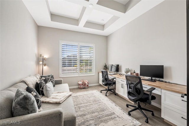 office area with beamed ceiling, light hardwood / wood-style floors, and coffered ceiling