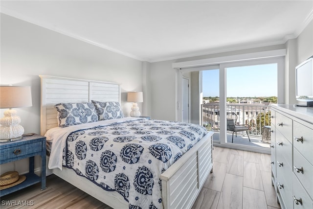 bedroom with access to exterior, light hardwood / wood-style flooring, and ornamental molding