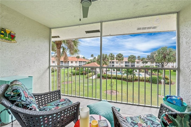 648 Mardel Ct Unit 708, Naples, FL 34104 - sunroom / solarium with a ceiling fan and a residential view