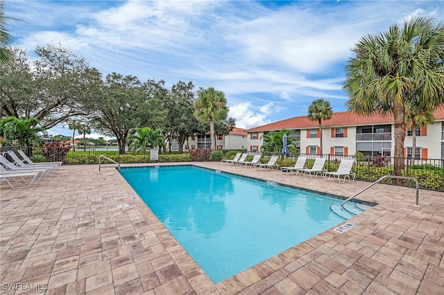 view of swimming pool featuring a patio area