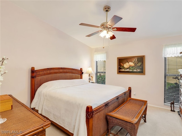 bedroom featuring ceiling fan and light colored carpet