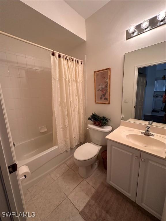 full bathroom with tile patterned floors, vanity, toilet, and shower / tub combo