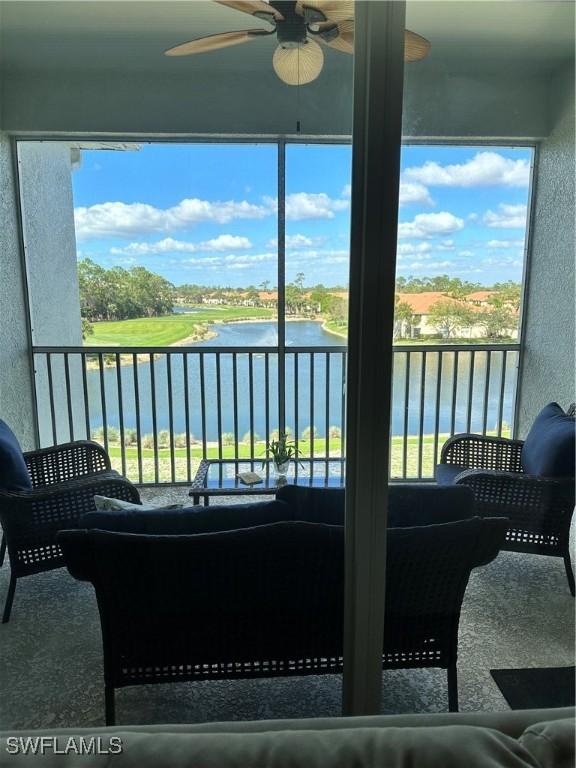 sunroom / solarium with a water view