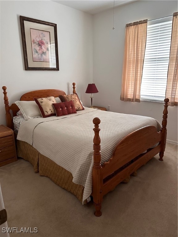 bedroom featuring light carpet