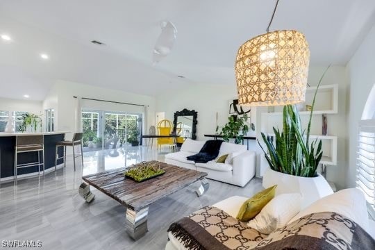 living room featuring lofted ceiling