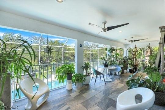 sunroom / solarium with ceiling fan