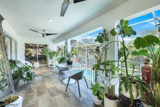 sunroom / solarium with ceiling fan