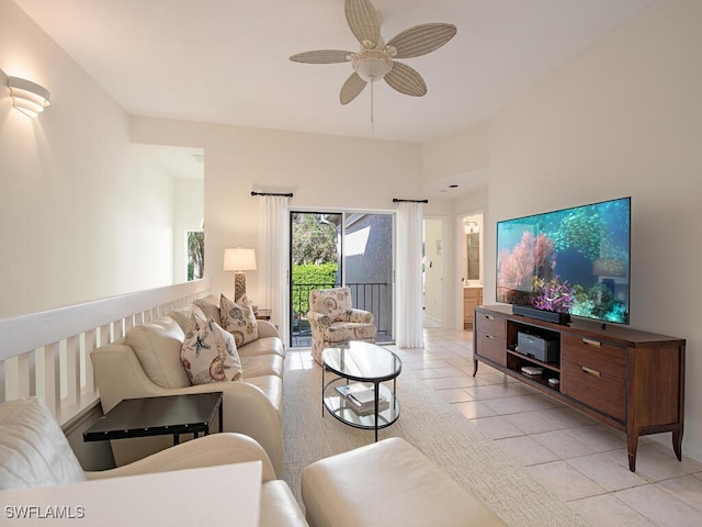 tiled living room with ceiling fan