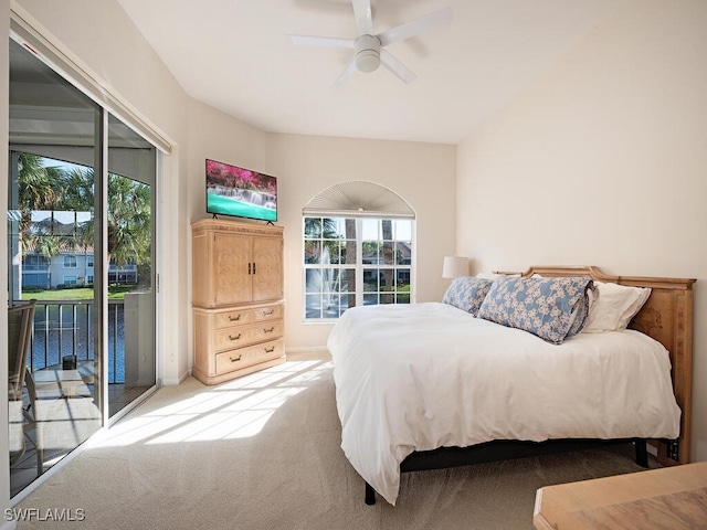 bedroom with carpet flooring, ceiling fan, and access to outside