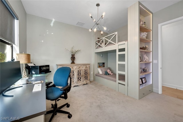 office area with carpet, visible vents, and a notable chandelier