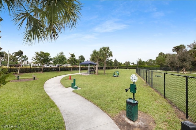 view of home's community featuring a gazebo, a yard, and fence